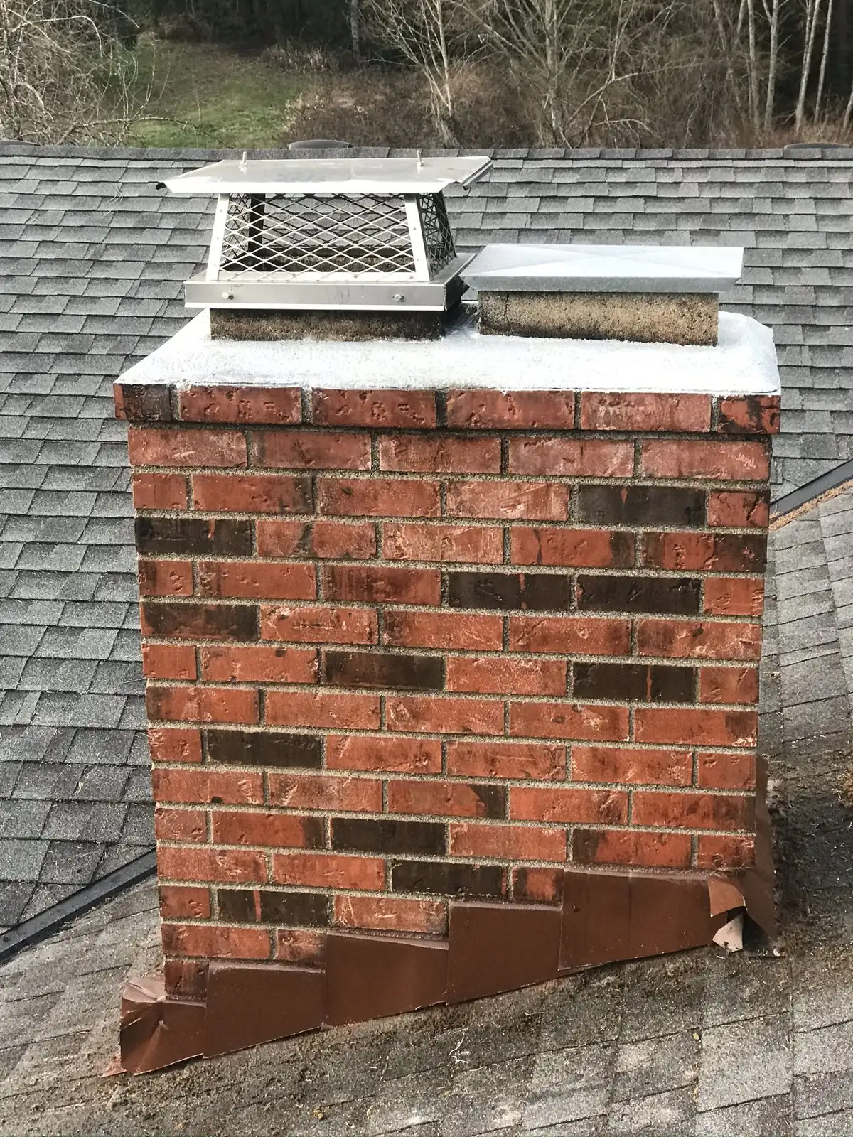 After: Professional chimney cap installed