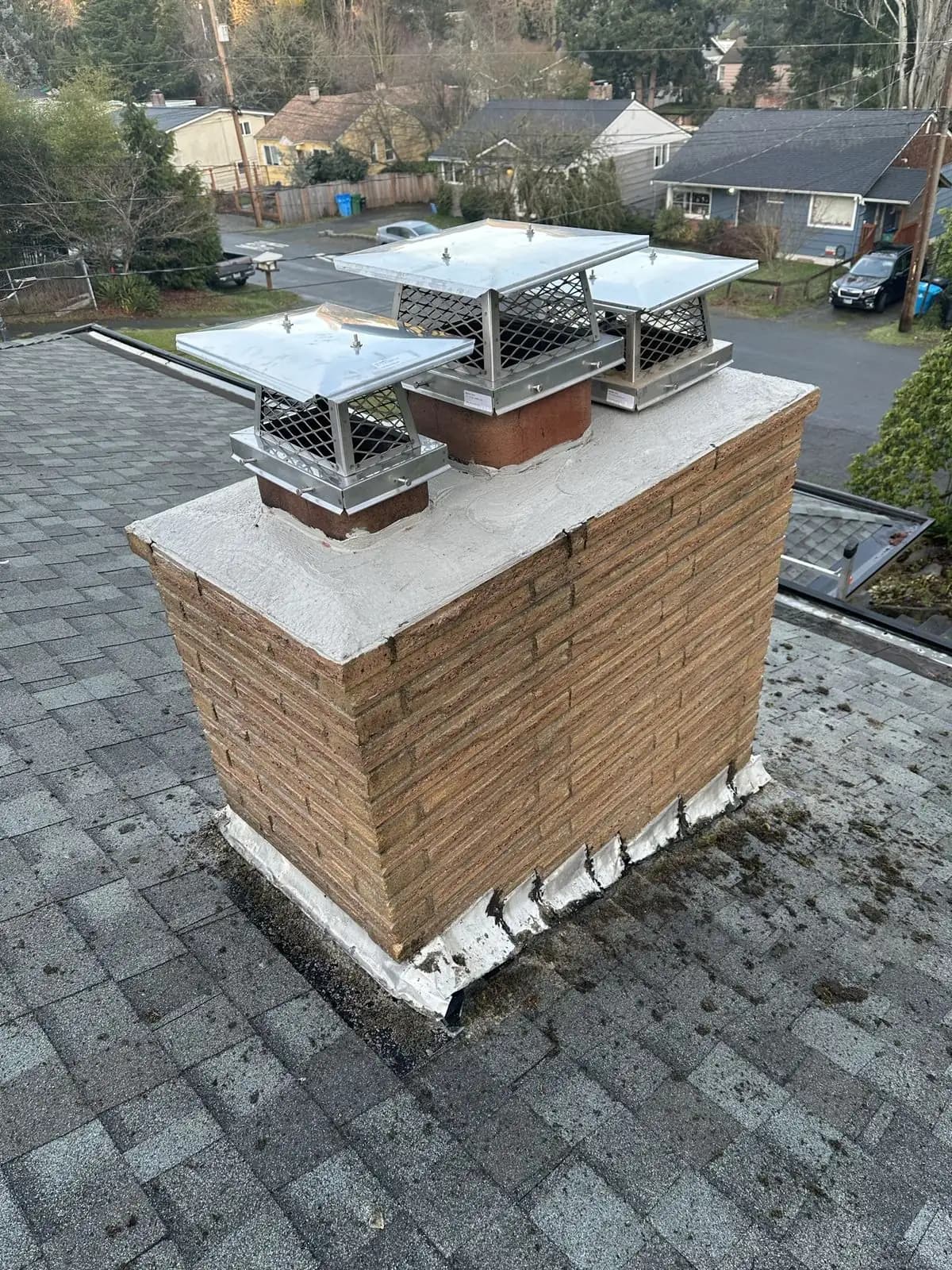 After: Clean, restored chimney with new protective caps